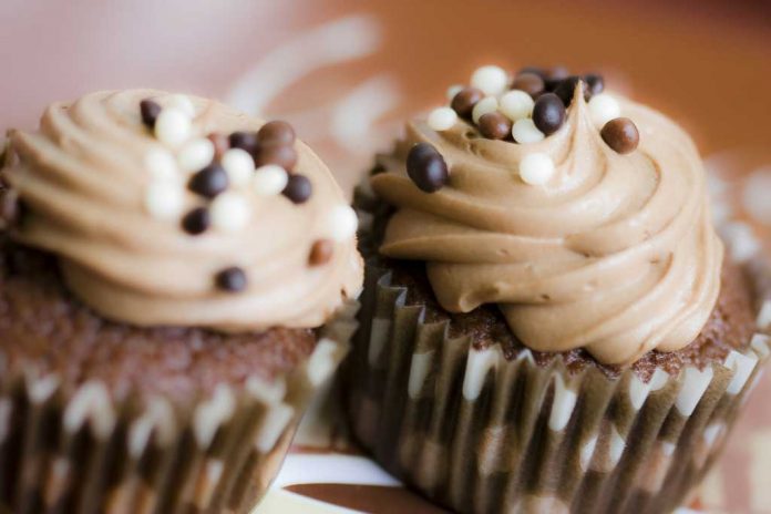 brownie-cupcakes Brownie Cupcakes with Peanut Butter Frosting and Chocolate Sprinkles.