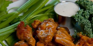 Key Lime Barbecue Wings on a plate with celery and blue cheese sauce.