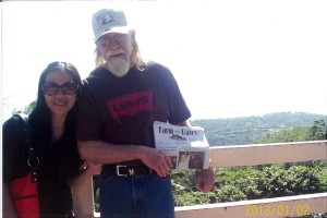 Randy Stoker, right, of Atlantic, Pa., sits with his friend Joy and the Farm and Dairy at Taal Volcano, at Tagaytay in the Phillipines. Randy visited the Phillipines from November until February.