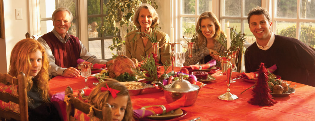 family gathered around Thanksgiving table