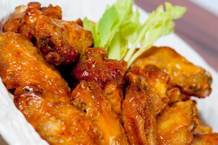 Honey Glazed Chicken Wings Honey Glazed Chicken Wings in bowl with celery.