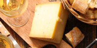 Dipping bread into the Seafood Cheese Fondue pot.