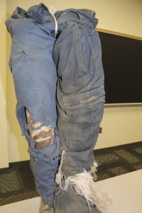 The difference between chain saw chaps (right) and no chaps (left).