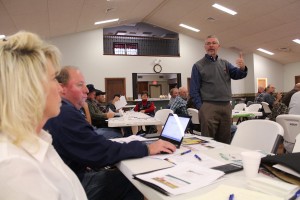 OSU's Cam Thraen (right), explaining new dairy policy.