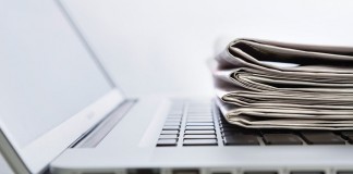 laptop and newspapers
