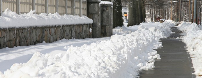 snowy sidewalk snowy sidewalk