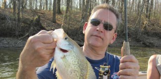 fisherman holding crappie