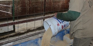 inmate pouring feed