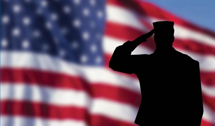 American flag and saluting soldier American flag and saluting soldier