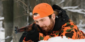 man shooting gun