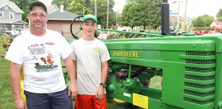 Father and son with John Deere