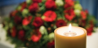 funeral flowers and candle