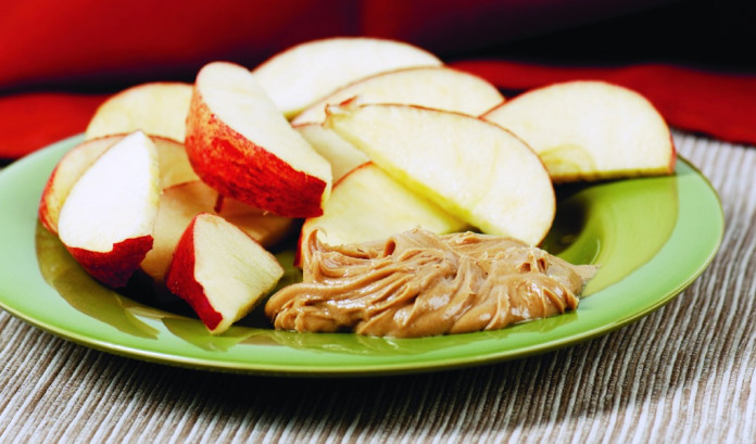 apple slices and peanut butter.healthy snacks apple slices and peanut butter are healthy snacks