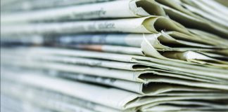 newspaper pile/Susan Crowell column