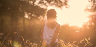 A girl at sunrise.