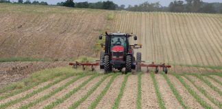 Tractor applying fertilizer