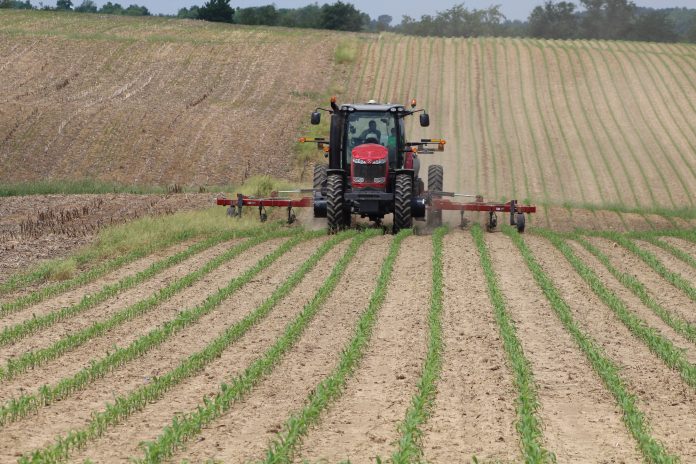 Tractor applying fertilizer Tractor applying fertilizer