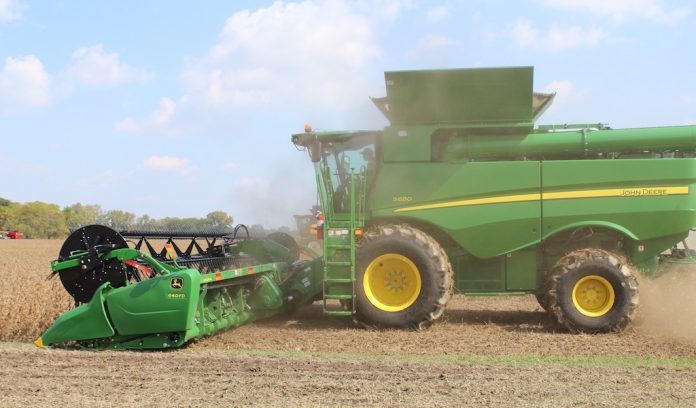 combine side combining soybeans