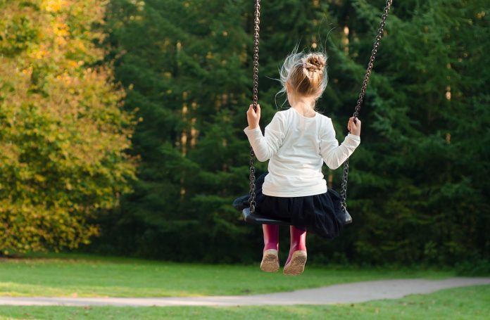 girl on swingset girl on swingset