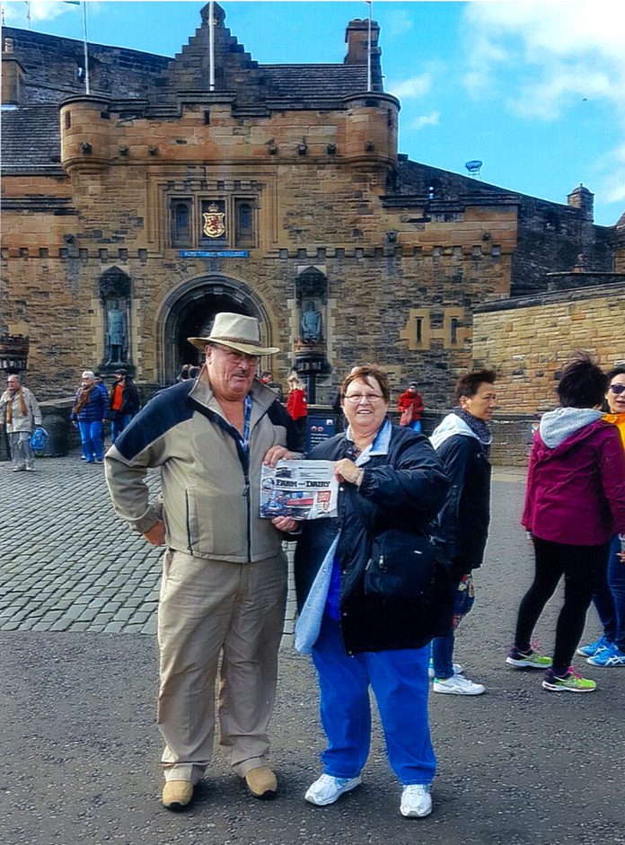 vac_larrick The Larricks standing in front of Edinbugh Castle in Scotland with their Farm and Dairy