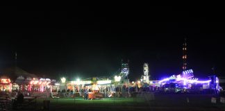 A farm show with lights in the evening.