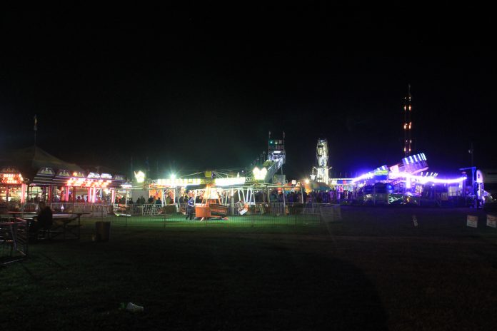 Butler Farm Show A farm show with lights in the evening.