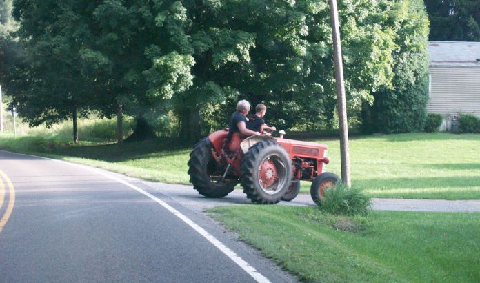 Two riders on tractor Two riders on tractor