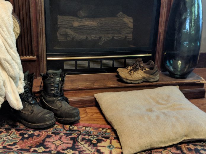 boots by a doorway boots by a doorway