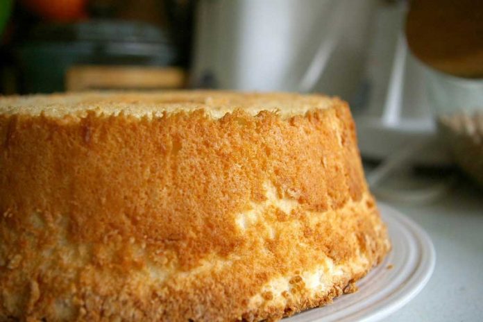Angel Cake Angel Cake cooling on a plate after being removed from its pan.