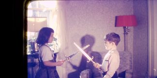 Kym Seabolt in a childhood sword fight.