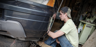 BoyWonder repairing his vehicle