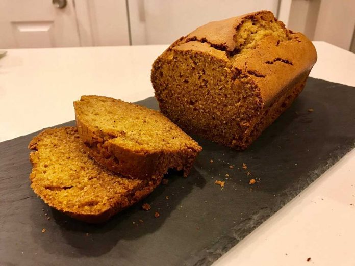 Pumpkin Bread Pumpkin Bread on a slate cutting board with slices.