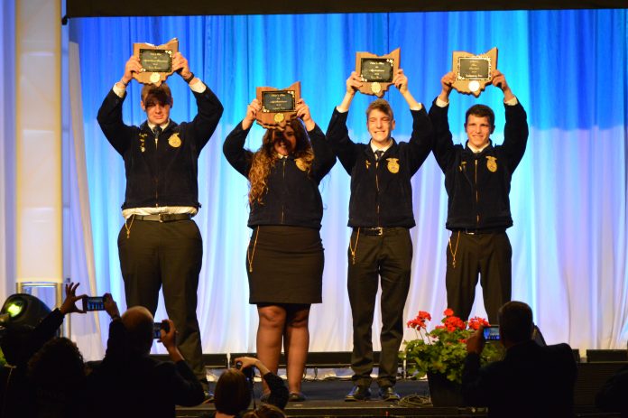 starfarmers The FFA’ers who earned state Star awards, or Stars Over Ohio, celebrated following their introduction during the state convention May 2-3. Pictured (L-R) Cody Clark, Zane Trace FFA; Madison Whitt, Ridgewood FFA; Jacob Wuebker, Versailles FFA; and Montgomery Boes, Upper Sandusky FFA. (Mickayla Overholt photo.)