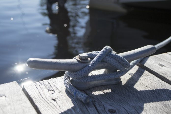boat tied off to a dock boat tied off to a dock