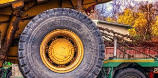 wheel of a construction tractor strapped down