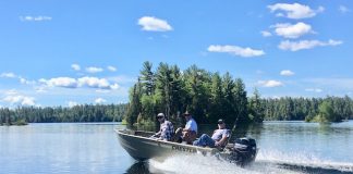 three men on a boat
