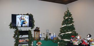 Agricultural toys under a Christmas tree.