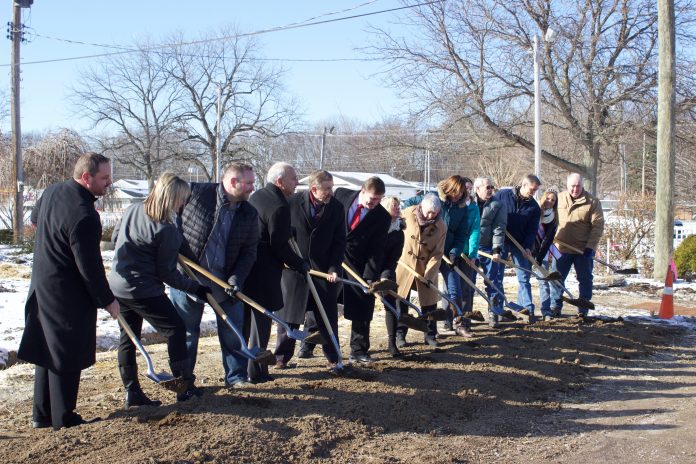 lake fair friends and supporters of the fair line up with shovels for the groundbreaking.