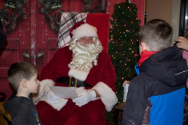 Santa talks to two young boys about what they want for Christmas.