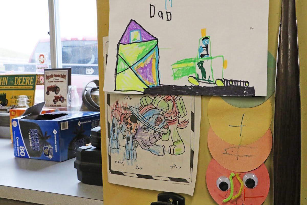 children's drawings on fridge
