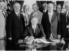 President Herbert Hoover signing the Farm Relief Bill in 1929.