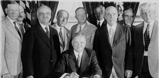 President Herbert Hoover signing the Farm Relief Bill in 1929.