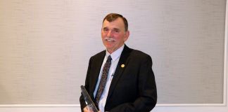 Russell Kiko holds his award.