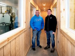 Brothers Todd, left, and Jason Frye stand in between rooms where they will make cheese at left, and teach about cheese at right.