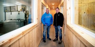 Brothers Todd, left, and Jason Frye stand in between rooms where they will make cheese at left, and teach about cheese at right.