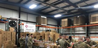national guard members packing food