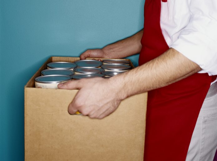food bank guy carrying cans