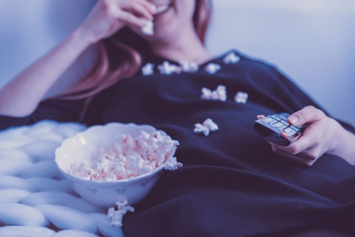 woman eating popcorn woman eating popcorn