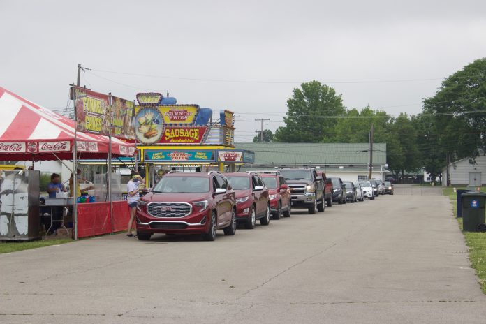 fair_food_fix_4 Cars line up next to concessionaires' stands at the Canfield Fairgrounds.