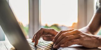 hands on laptop